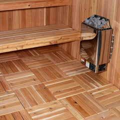 Red cedar floor tiles in a sauna with heater